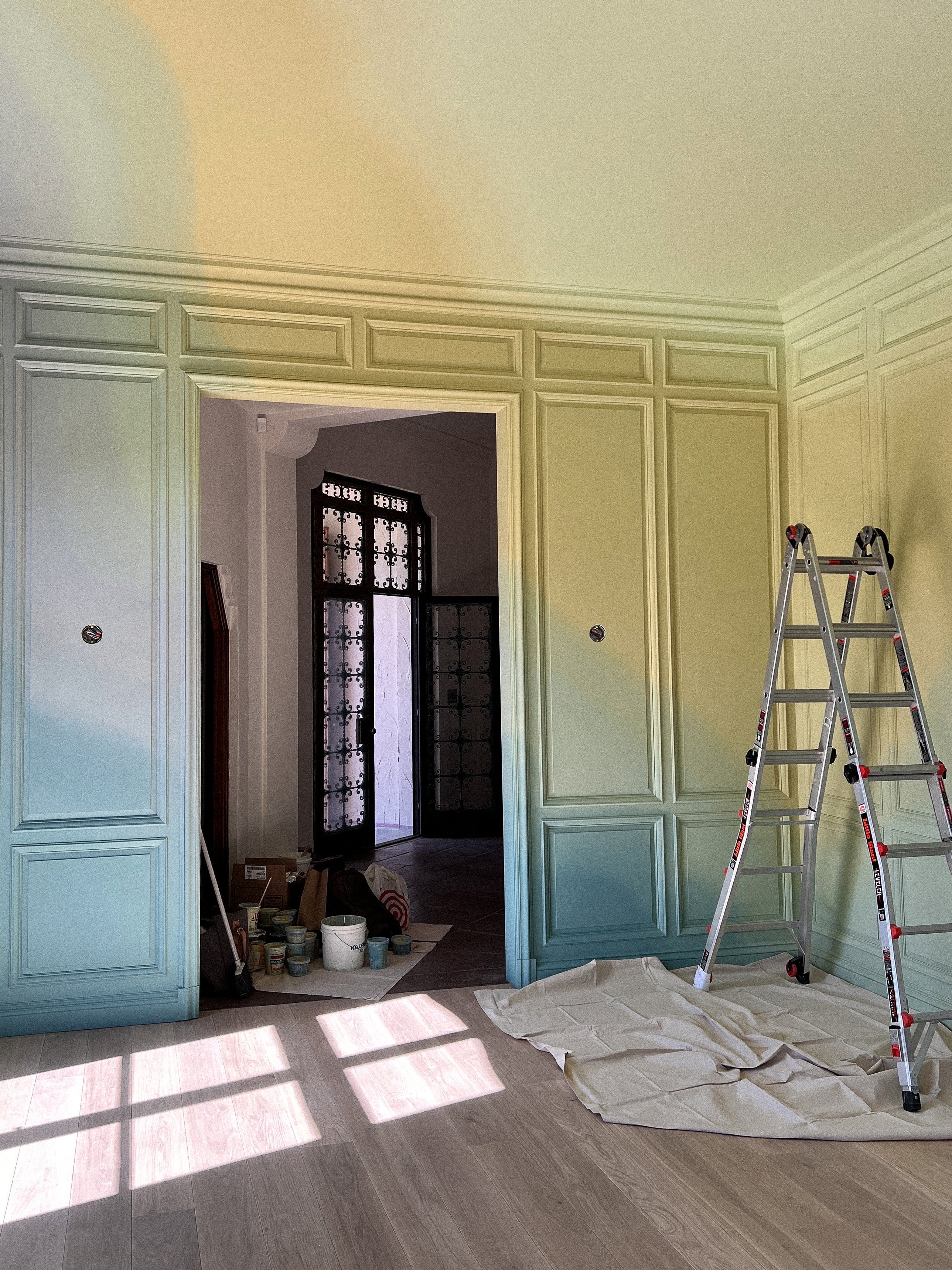 Muralist Rafael Arana’s gradated colorations in progress in the Apollonia Dining Room