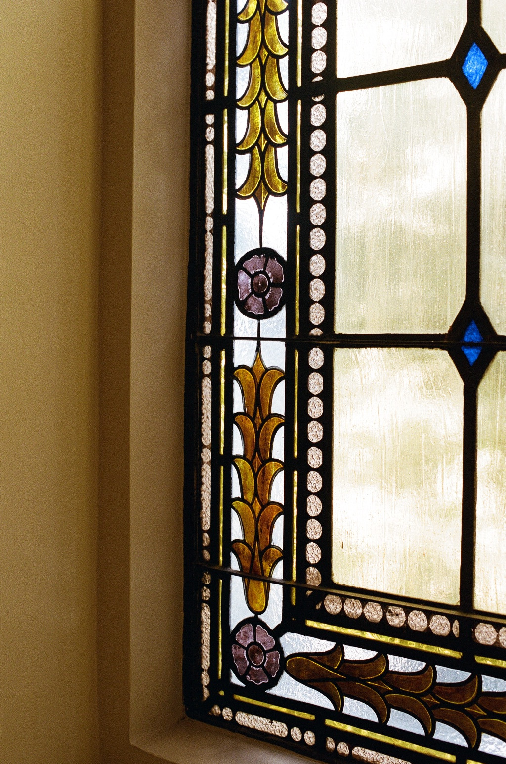 Stunning stained glass details adorn the original Spanish revival architecture, exuding the drama, glamor, and artistry of the era.