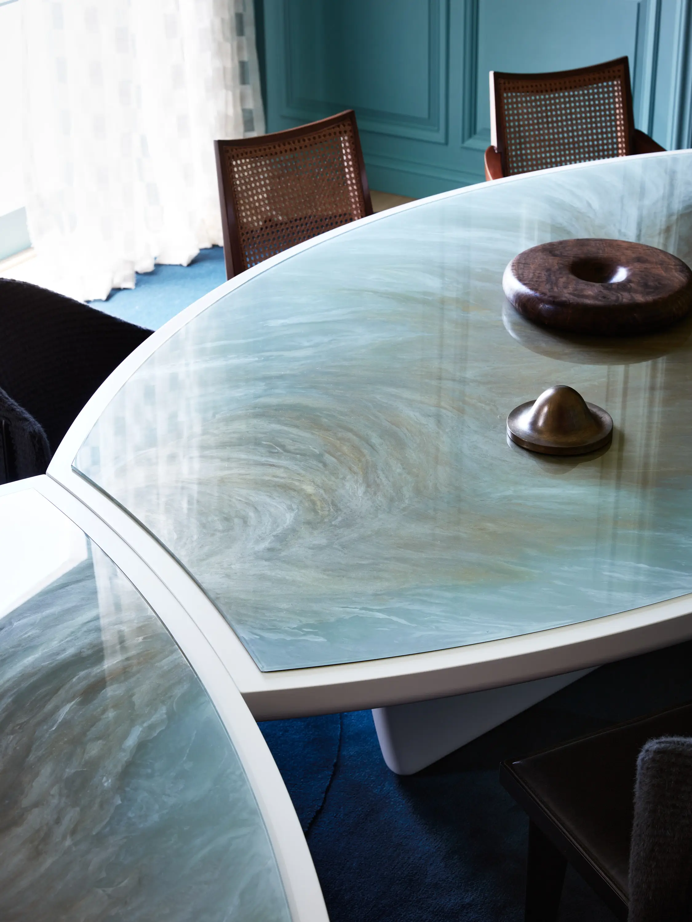 Detail of a custom verre églomisé dining table by Chroma.