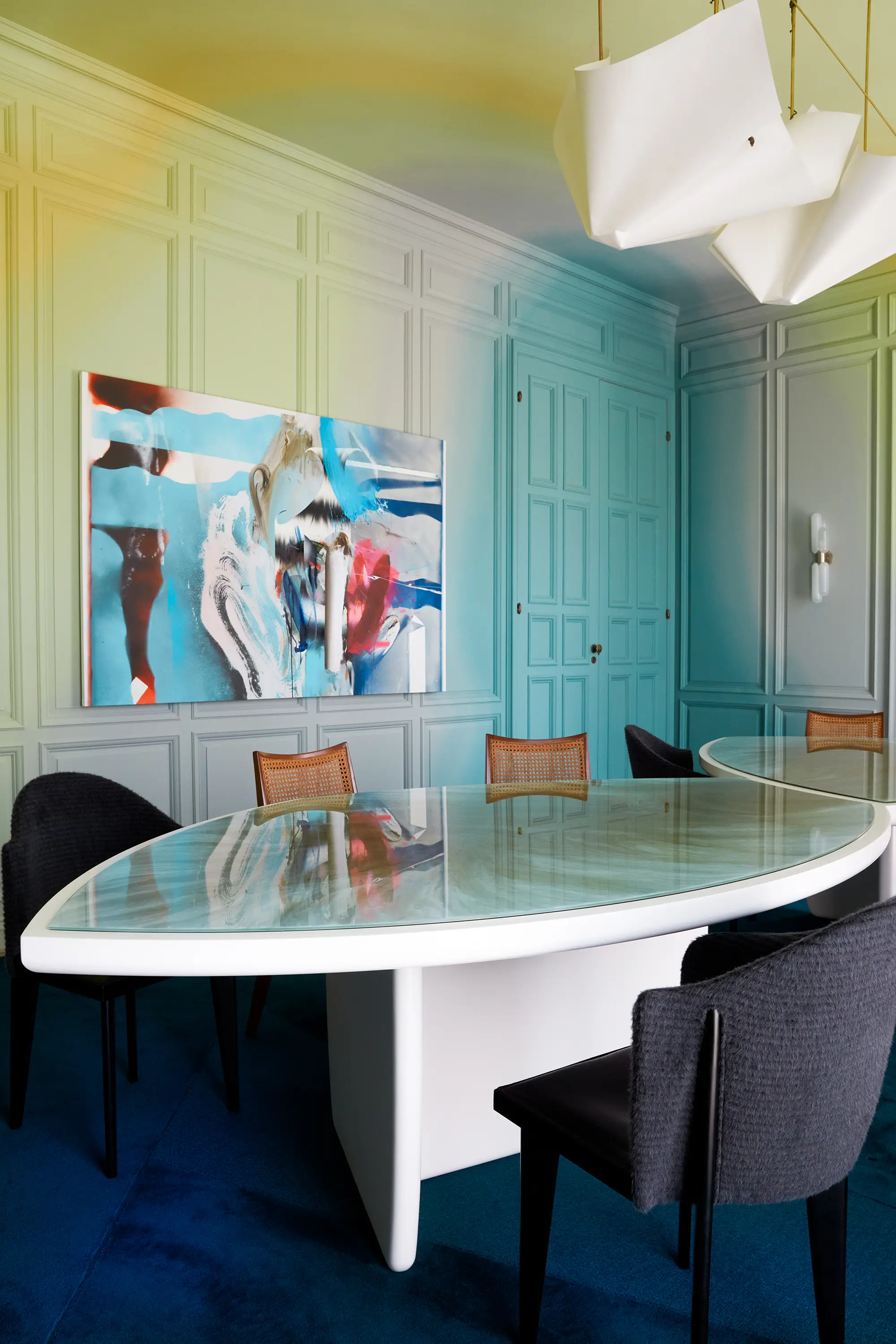 Installation view, Apollonia Dining Room at San Francisco Decorator Showcase 2023. Liam Everett’s Untitled (the smoke the feather the bones) effuses palpable chemistry with a custom mural by Rafael Arana beneath the astral plane of WHITE DIRT Studio’s GALA chandelier.