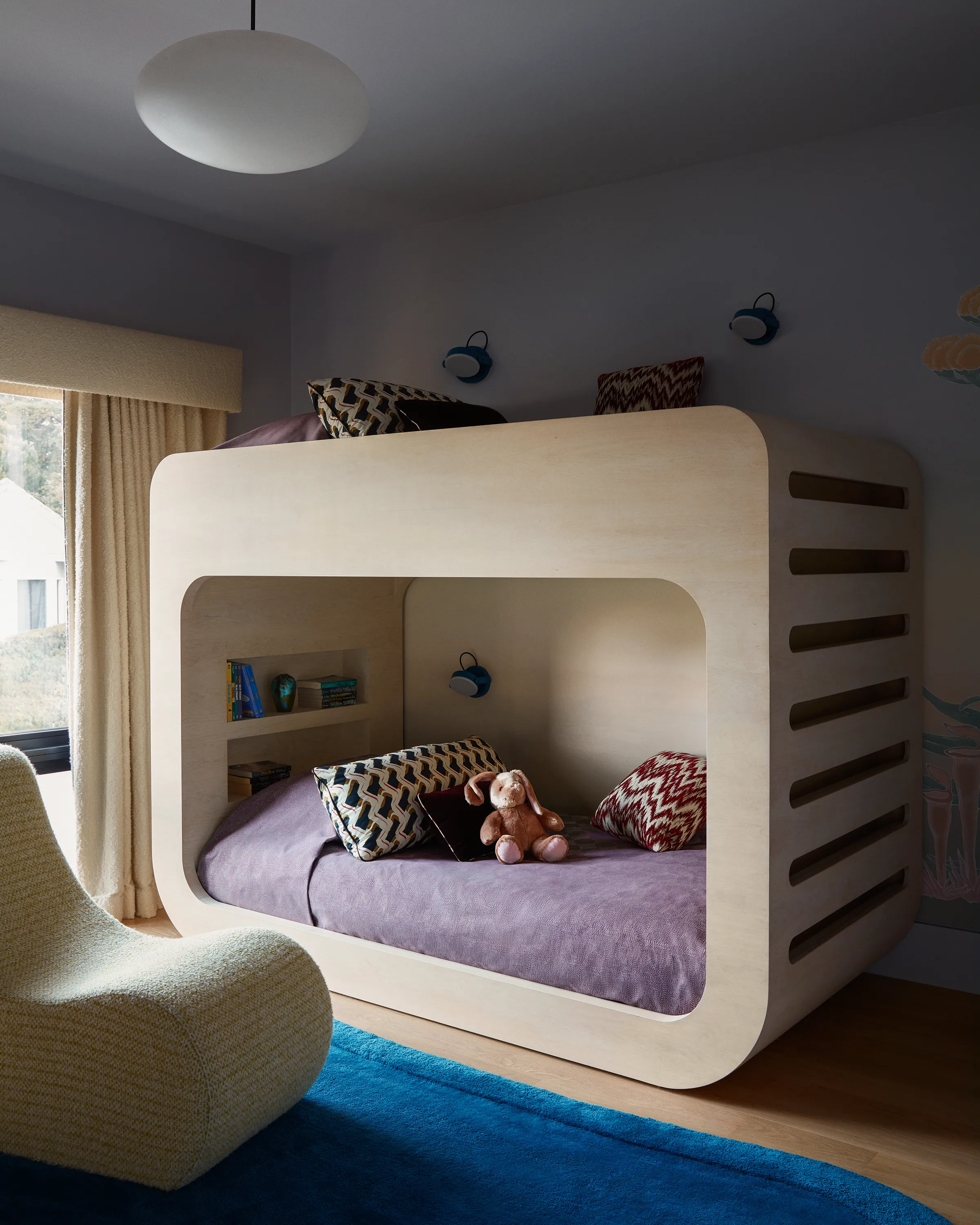 Chroma’s mod iteration on the bunk bed, with powder-coated Monocle scones by RBW, cozies below a vintage Stilnovo lamp. The sun-bleached oak twins with a vintage Verner Panton lounge chair in the swell of a custom Chroma x Mark Nelson rug.