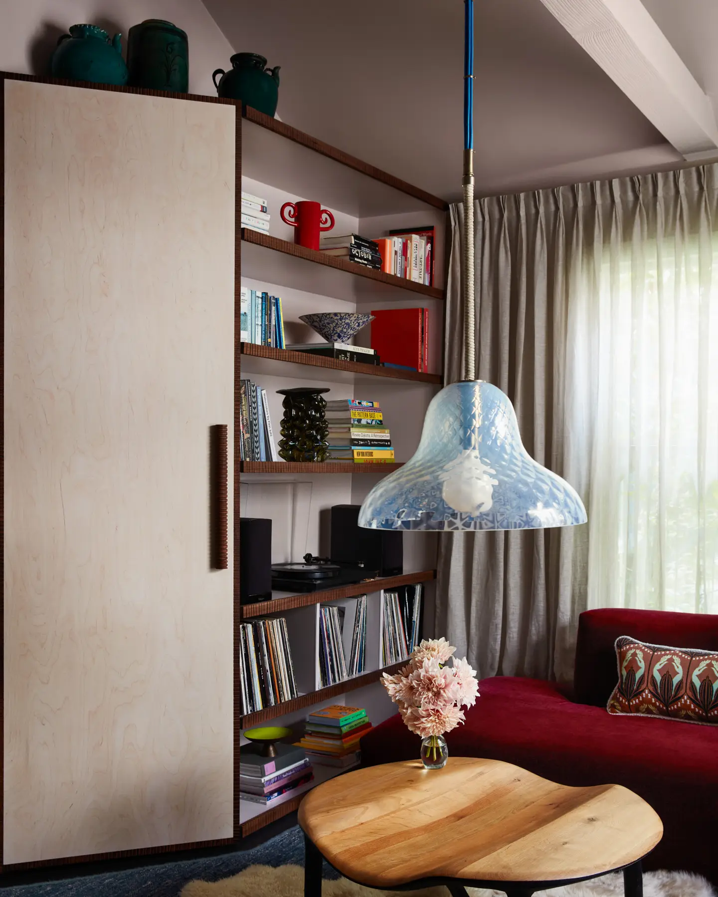 Custom cabinetry by Rafi Ajl and The Long Confidence platforms elevated curios featuring antique pottery and Sommer vessels.